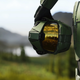 Master Chief holds a helmet in key art for Halo Infinite.